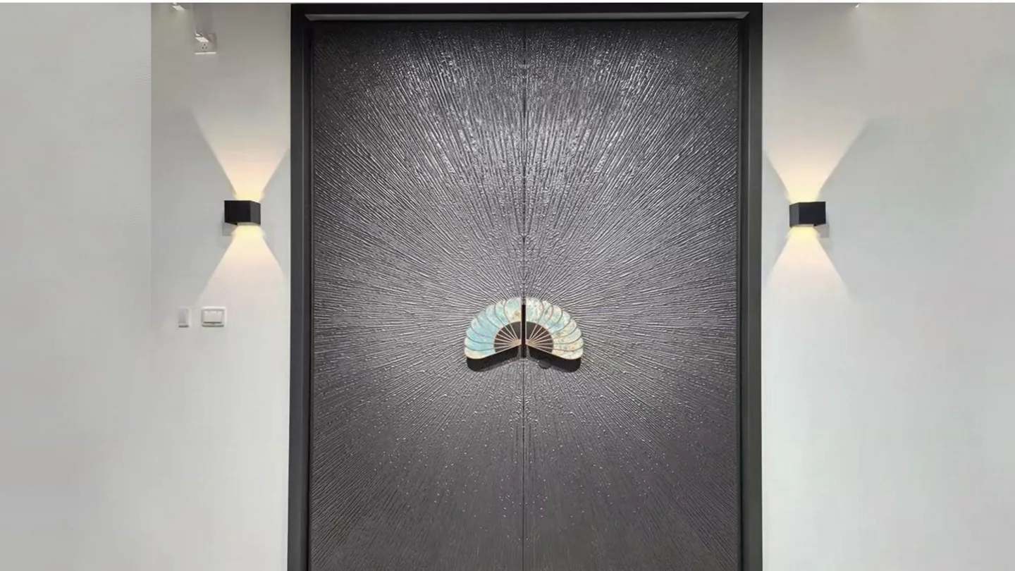 Bronze Chinese-style double entrance door with a carved fan ornament and wall sconces, design rendering