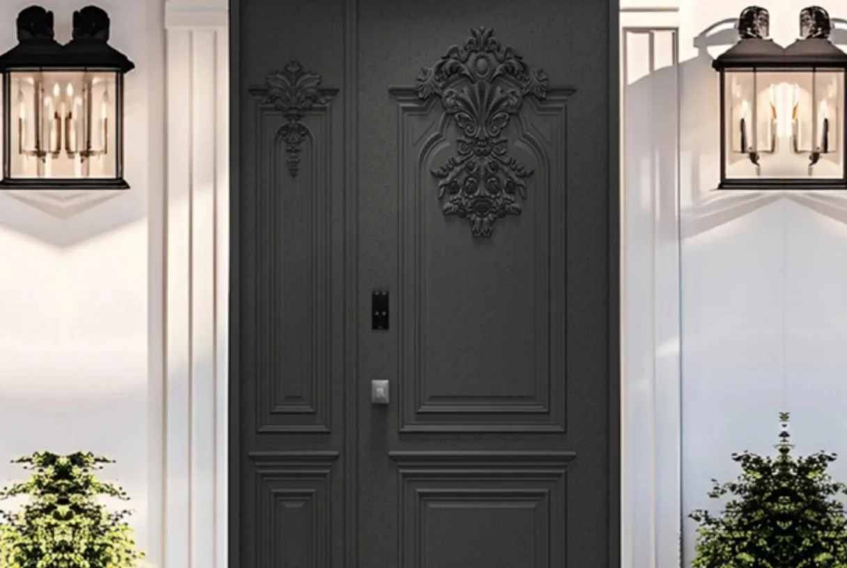 Black relief-faced main entrance leaf with a floral motif and lanterns on a plaster wall with planting, design rendering