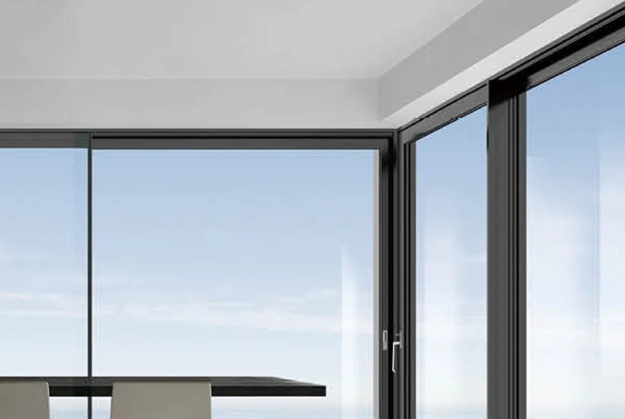 Lift and slide aluminium door with corner glazing and a slim dark mullion frame, design rendering