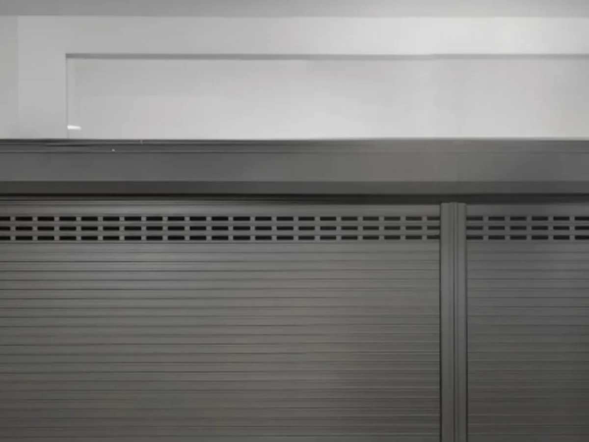 Aluminium roller shutter garage door half open on a rendered garage front, design rendering