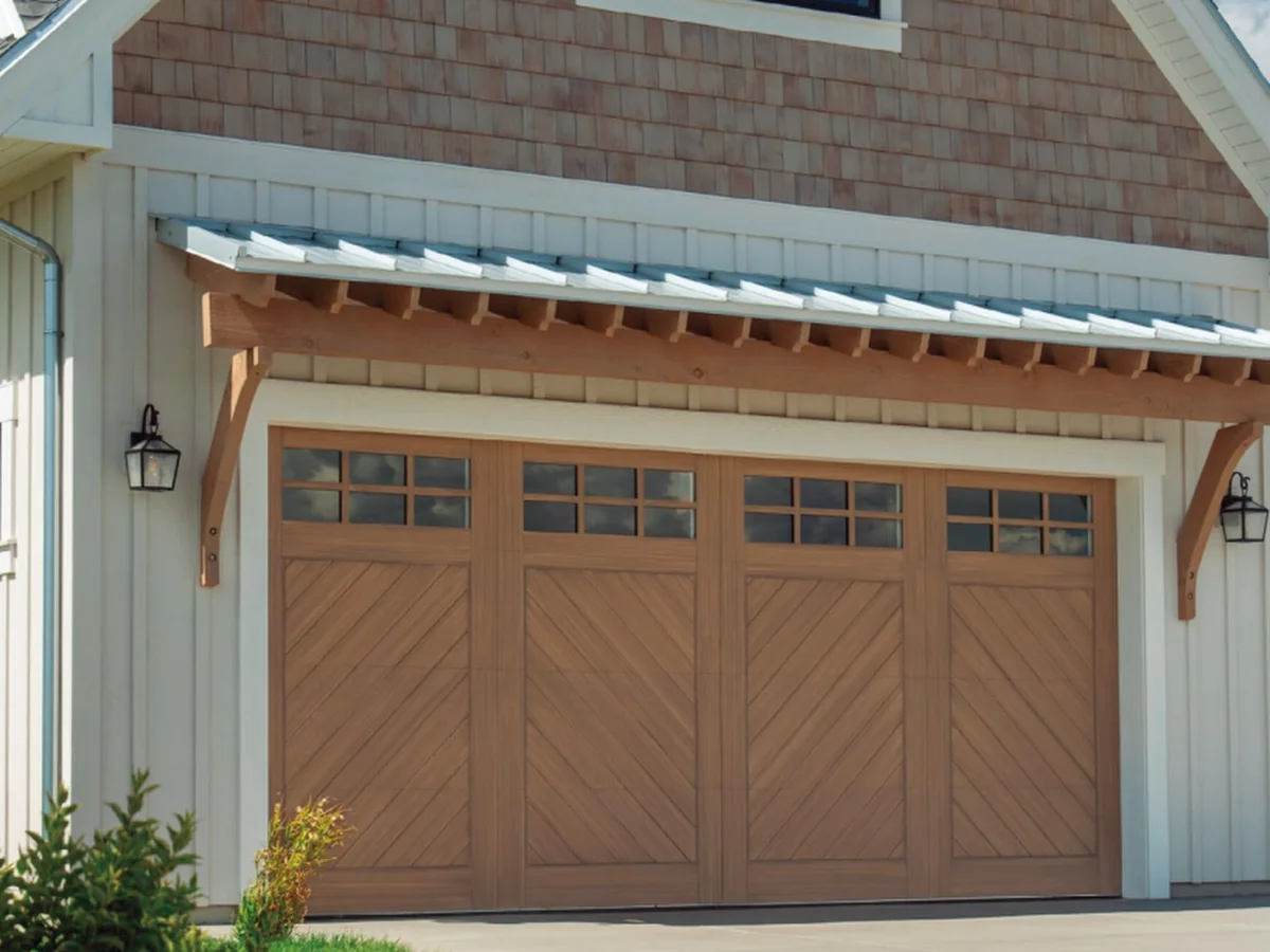Aluminium wood clad carriage-house garage door on a rendered frontage, design rendering